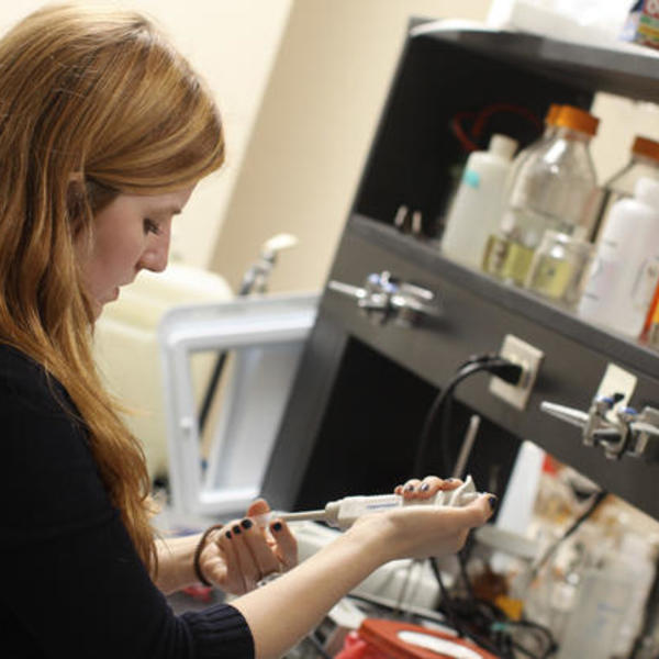 A woman working in a lab.