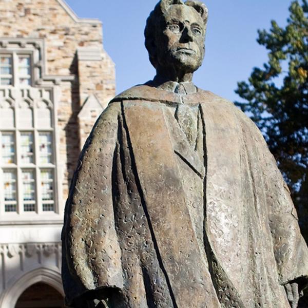 a statue of a man in academic robes