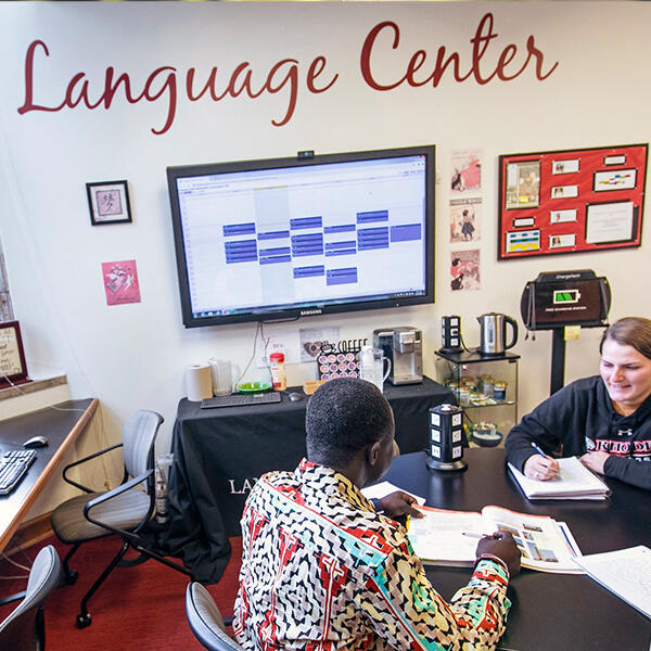 a professor and students in the Language Center