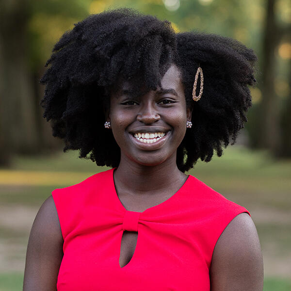 a young African American woman smiles at the camera