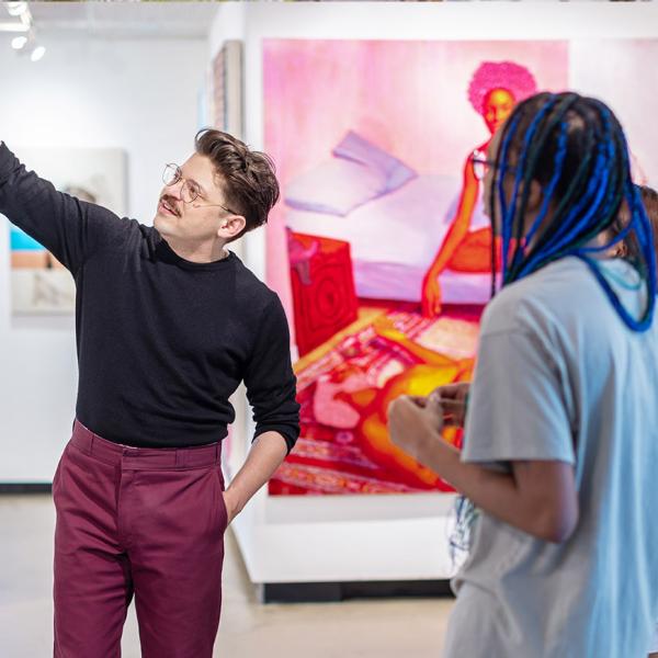 Professor Showing and teaching about an artwork