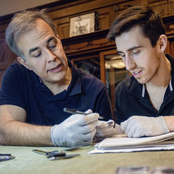a  professor and a student work on a project