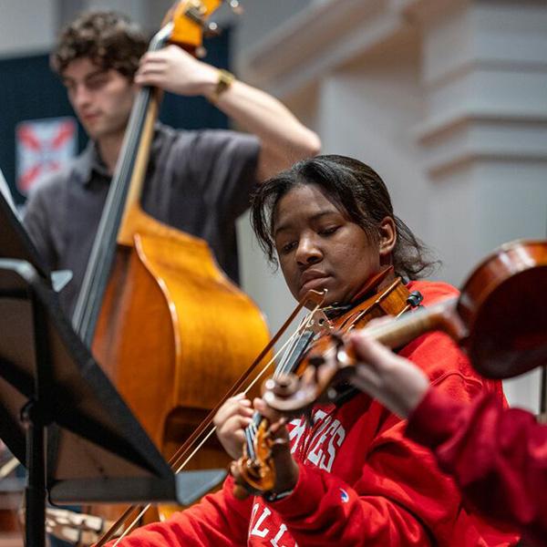 students play a bass and violin