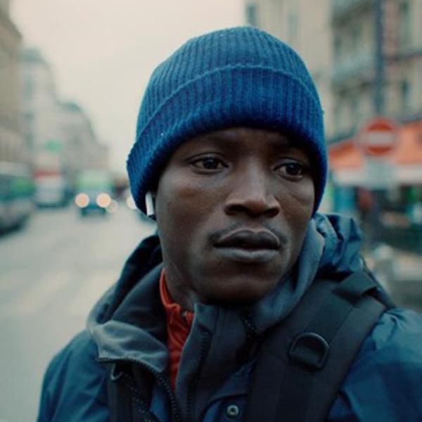 a Black man in a knit cap
