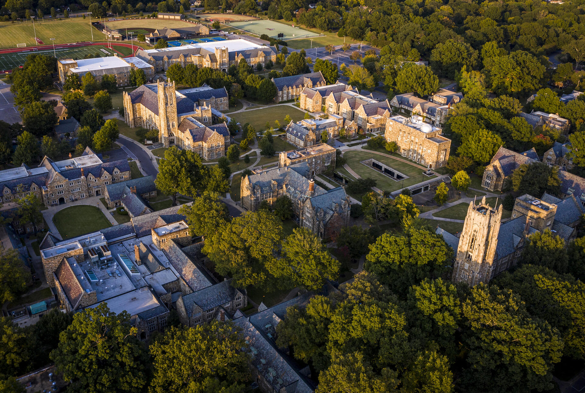 an aerial shot of a college campus with Gothic buildings