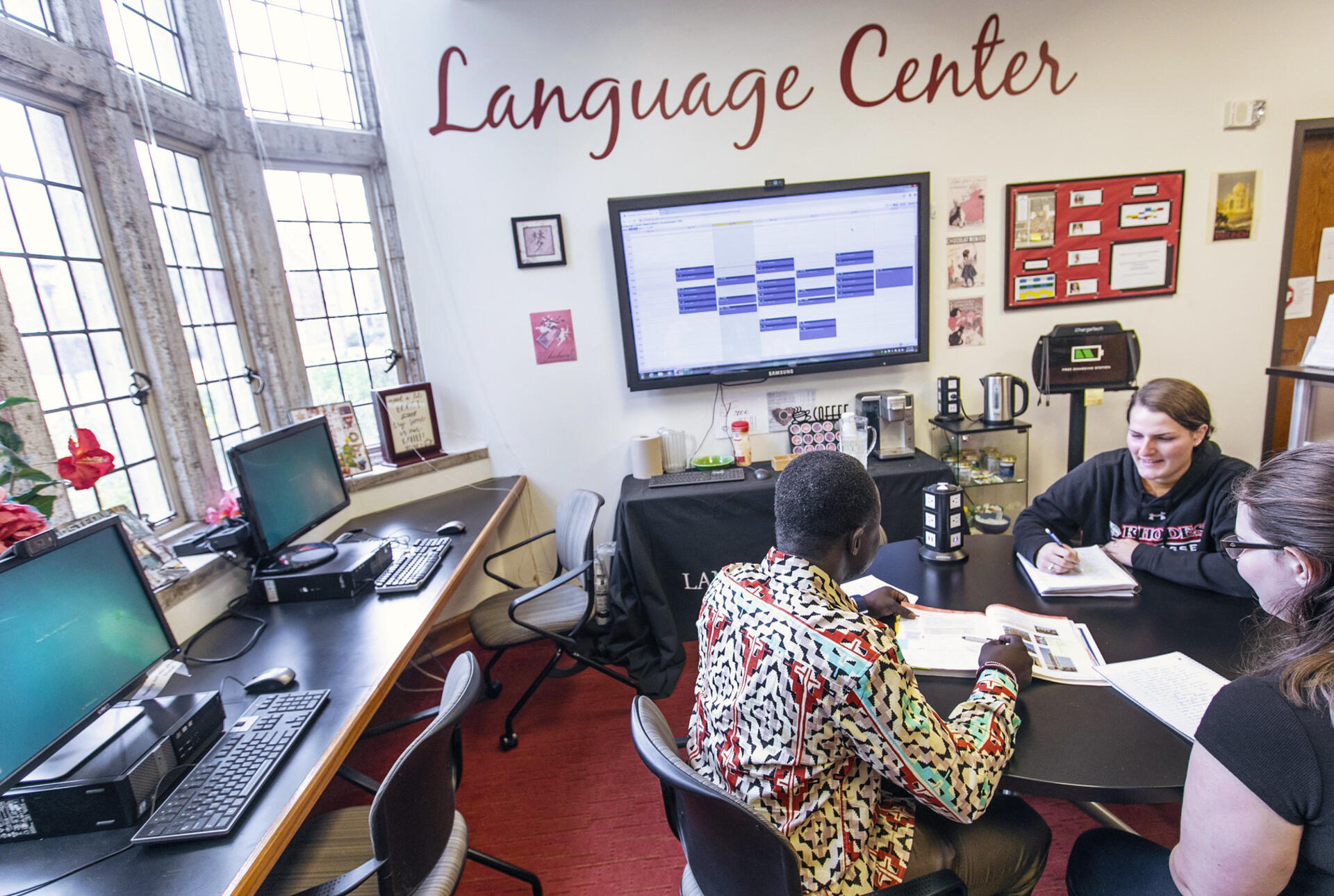 a professor and students study in the Language Center