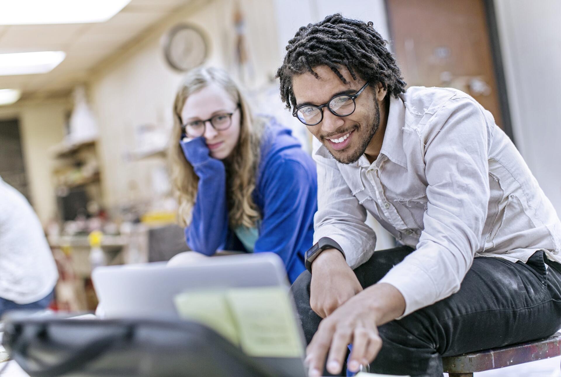 two students look at a computer