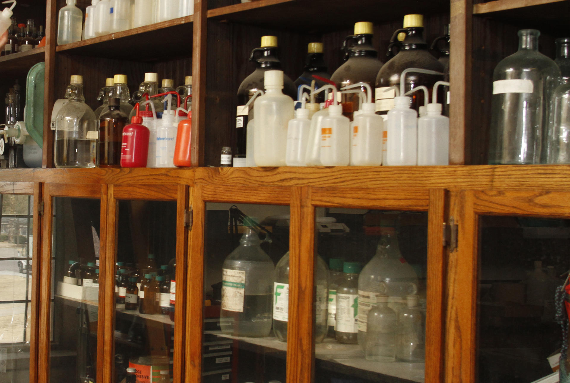 a collection of jars on a shelf.