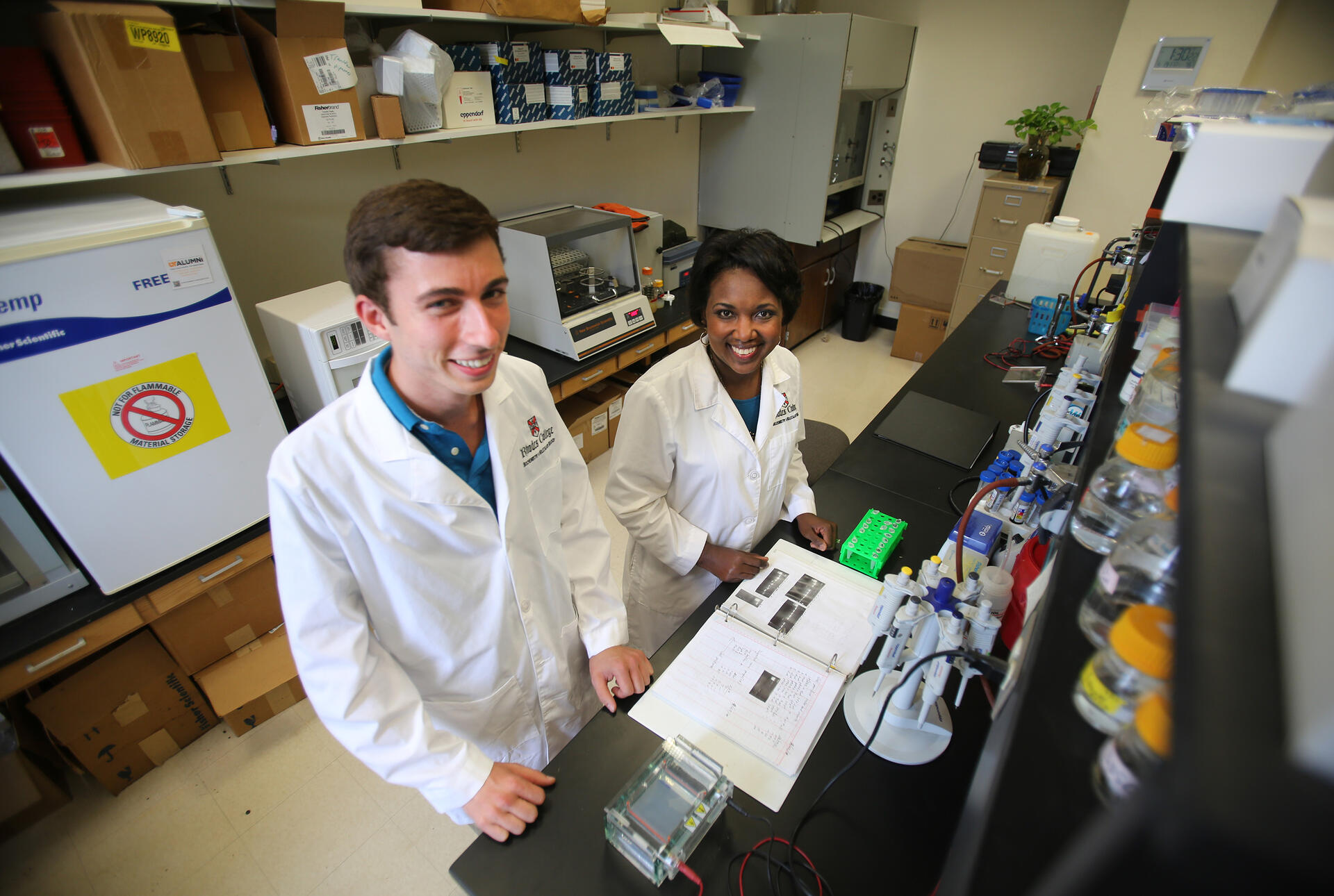 a student and professor in a lab