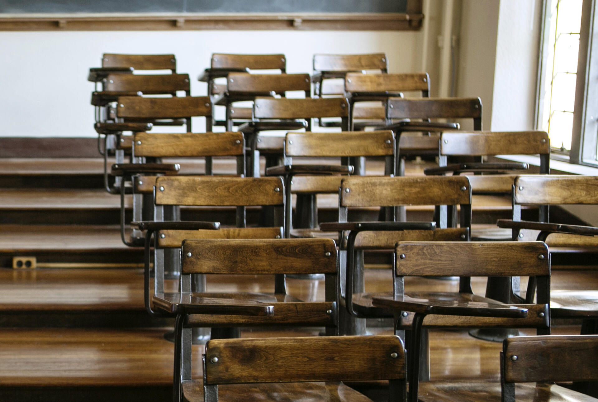 Empty lecture hall chairs