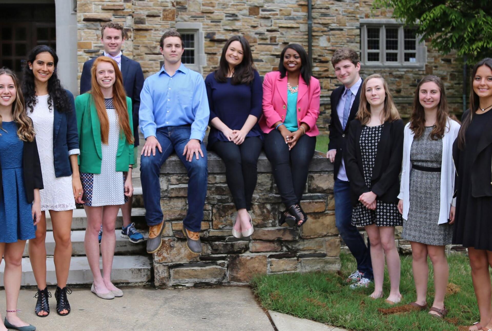 a group of students standing outside buckman hall