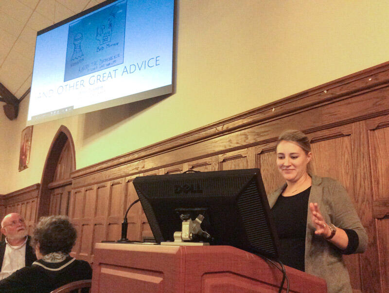 a young woman speaks at a lectern