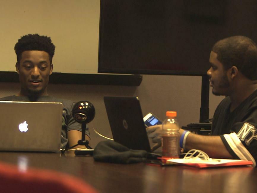 Bryce Hayes and PJ Settles recording an episode of their podcast.