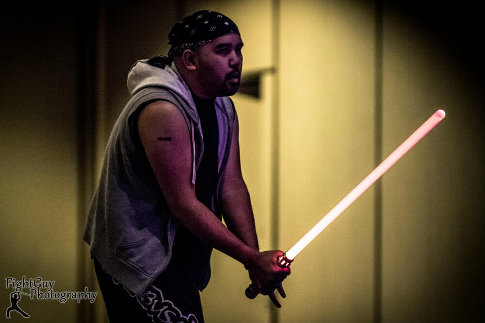 Carolino trains with a light saber