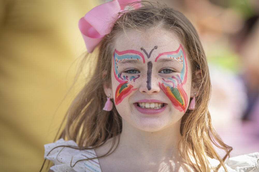 Child with butterfly face paint