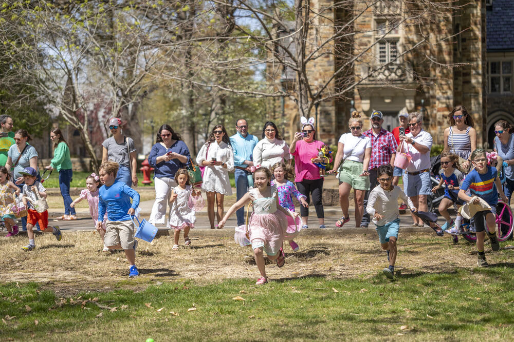 Children running to find Easter eggs