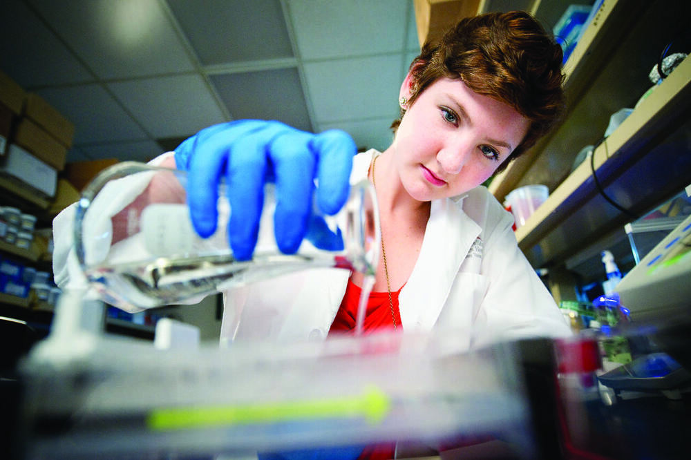 a young woman works in a lab