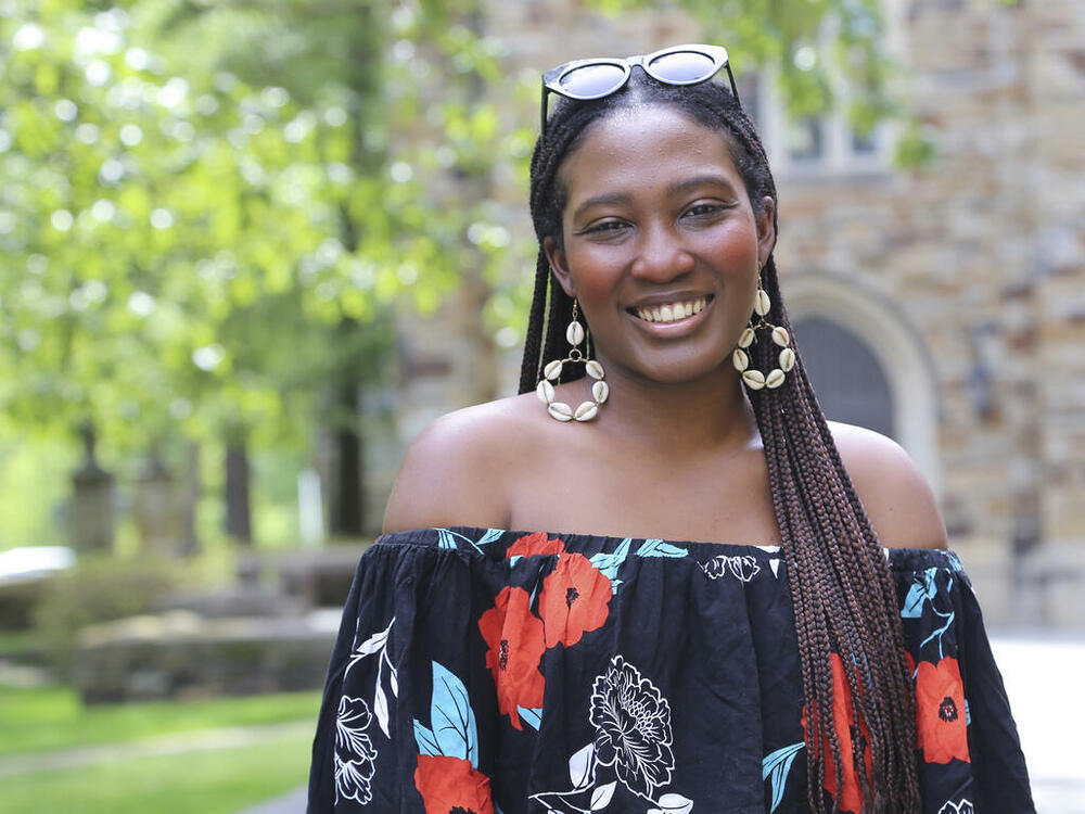 an young woman from Lagos, Nigeria, with large shell earrings