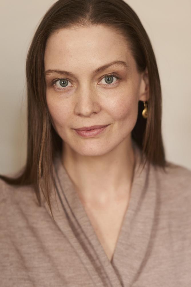 a woman with shoulder length brown hair