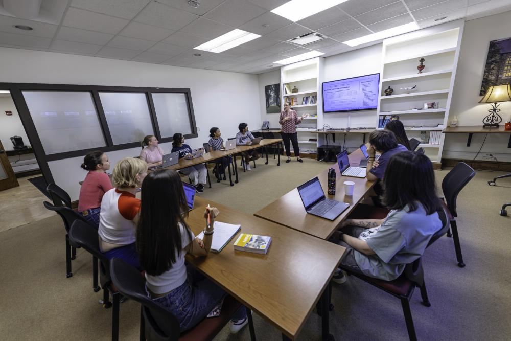 intimate classroom setting with professor up front