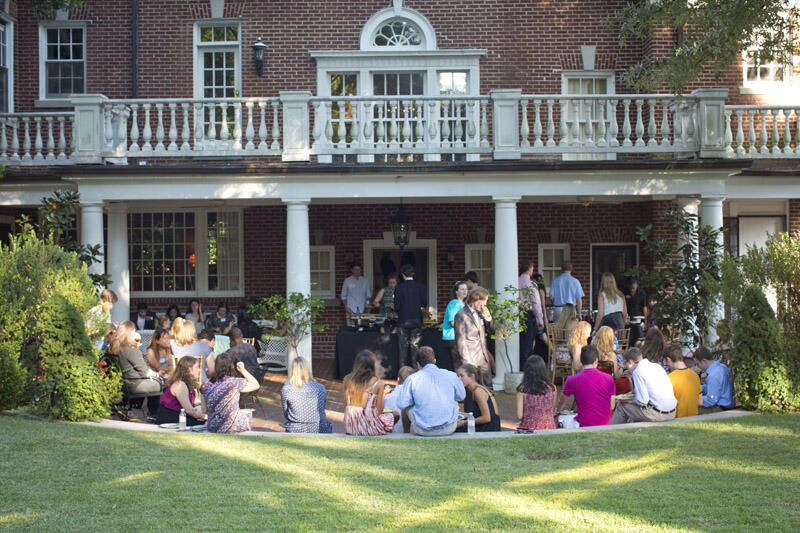 A group of people sit at the President's Home
