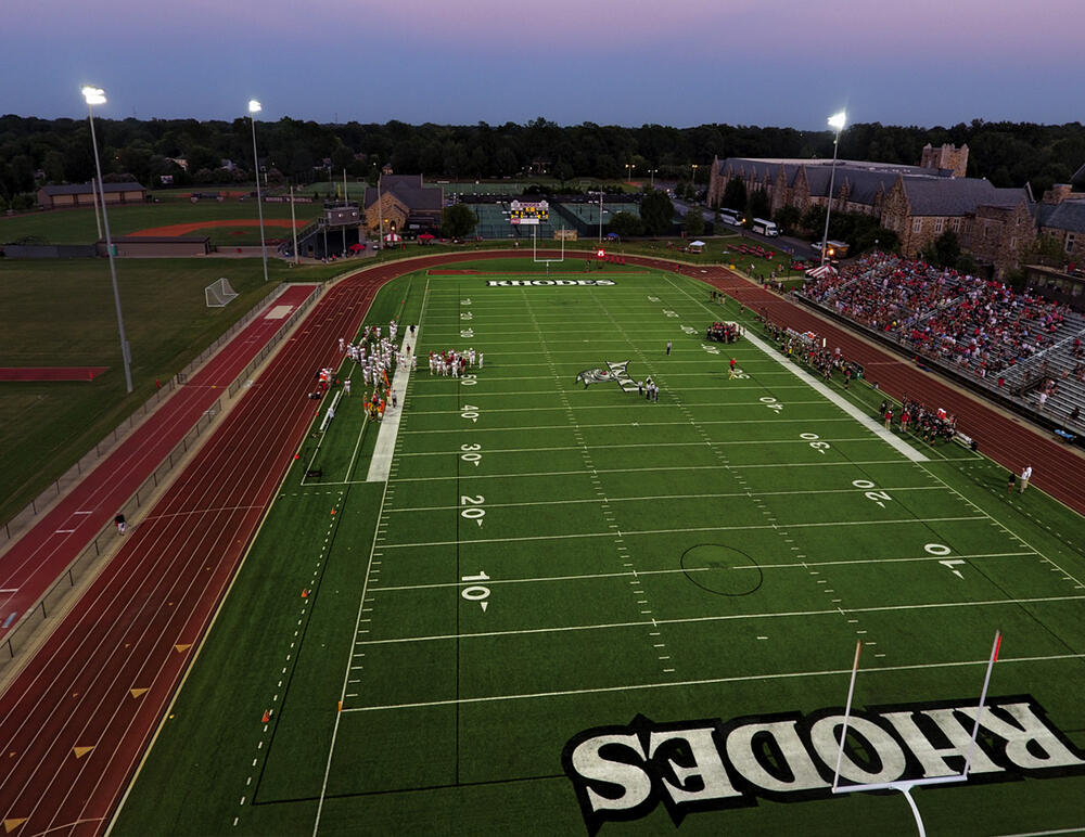 A football game in the evening