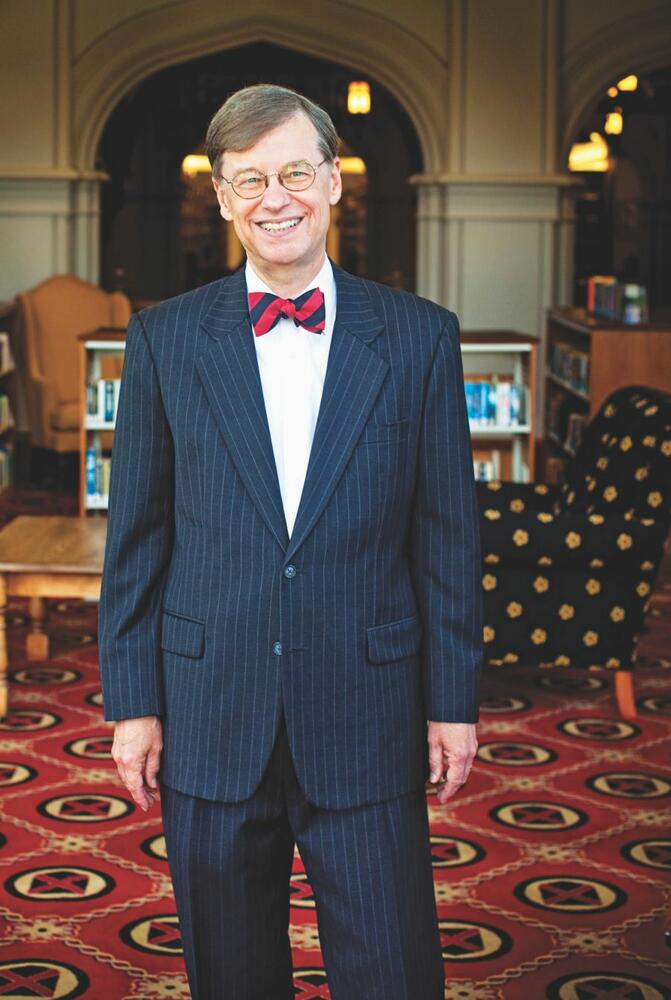 Dr. William E. Troutt in the Rhodes Library