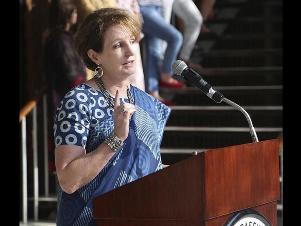 MaryKay Loss Carlson speaking at a podium