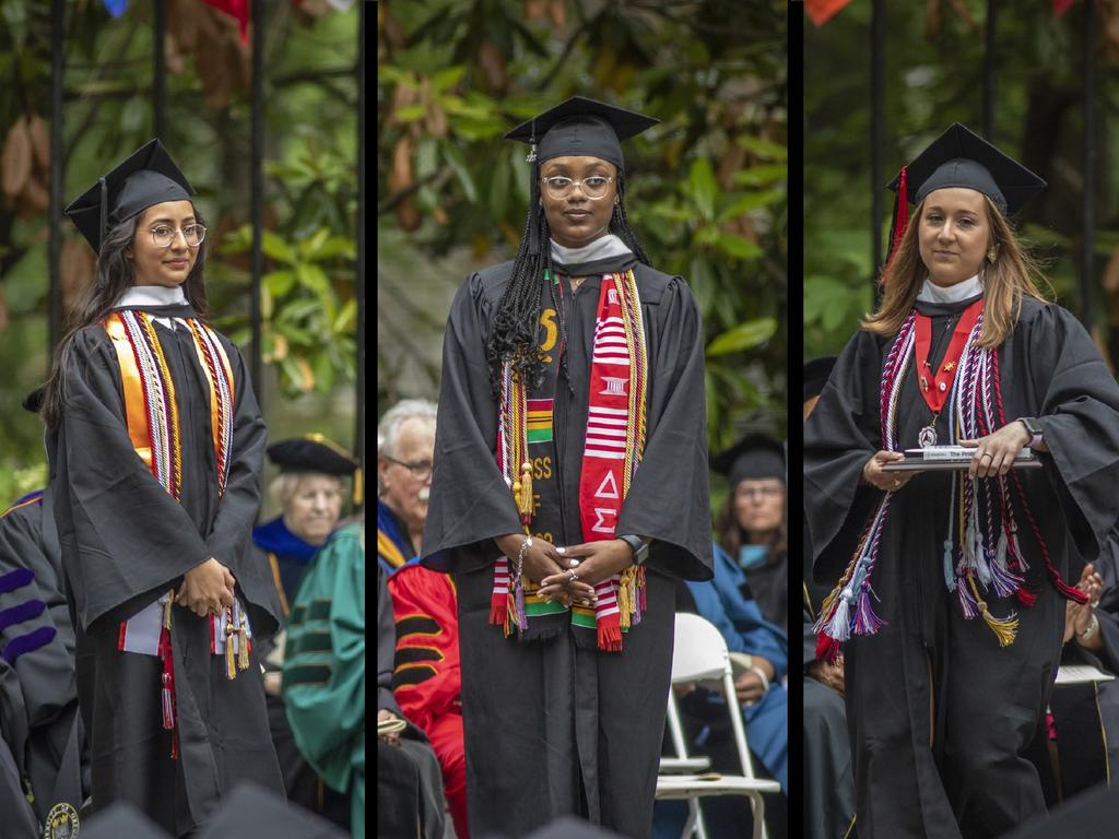 image of three students accepting awards at graduation