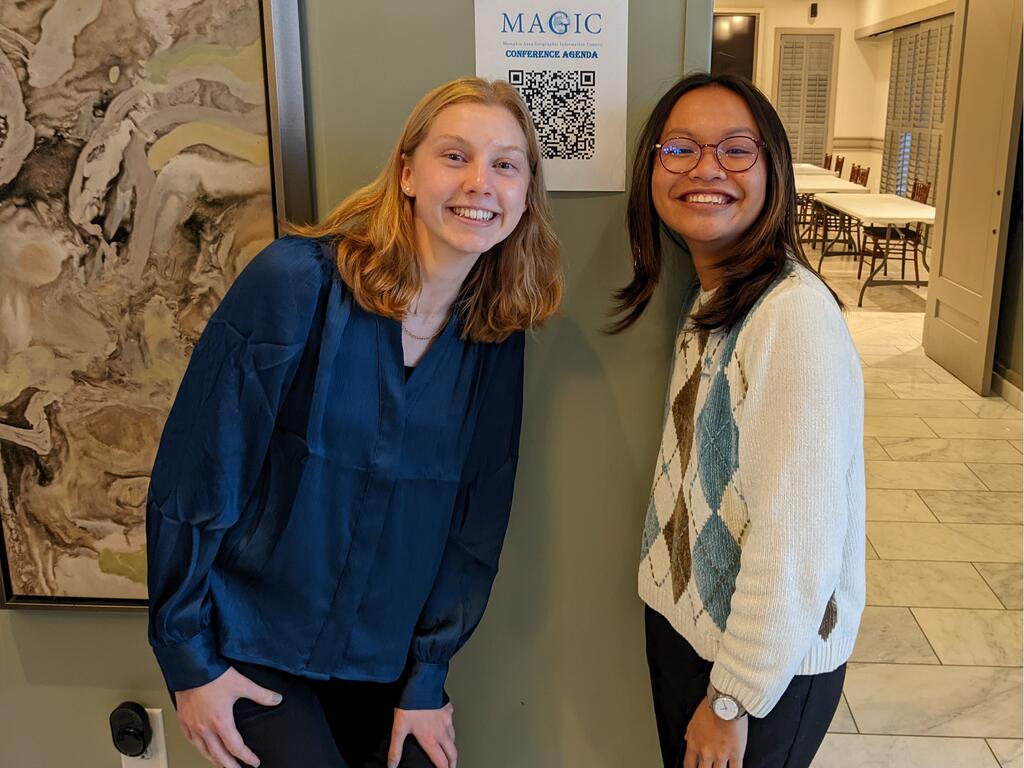 images of Rhodes College students Kathleen Cutting and Khanh Ton standing in front a conference room