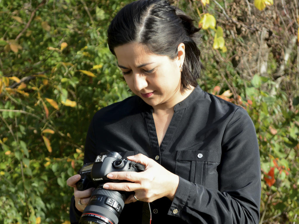 Picture of a woman holding a camera